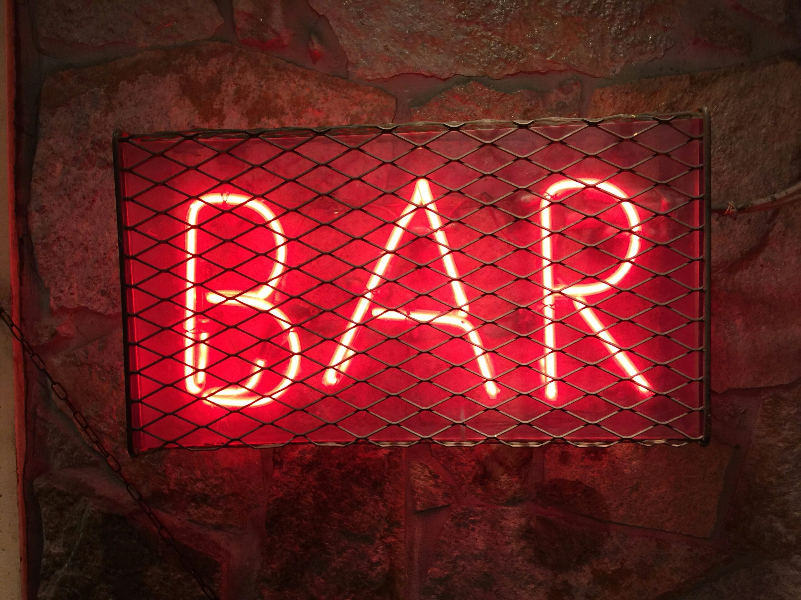 Neon sign saying Bar